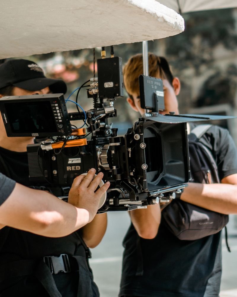 A film crew operating a camera rig on location